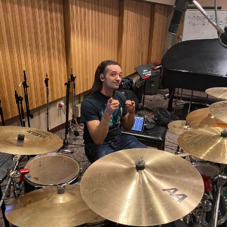 Paris Bierk posing for a picture with his drum set.